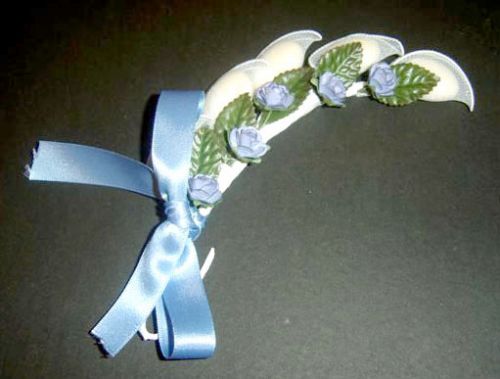 Blue Roses and Green Leaves on Rachetti with Blue Satin Ribbon
